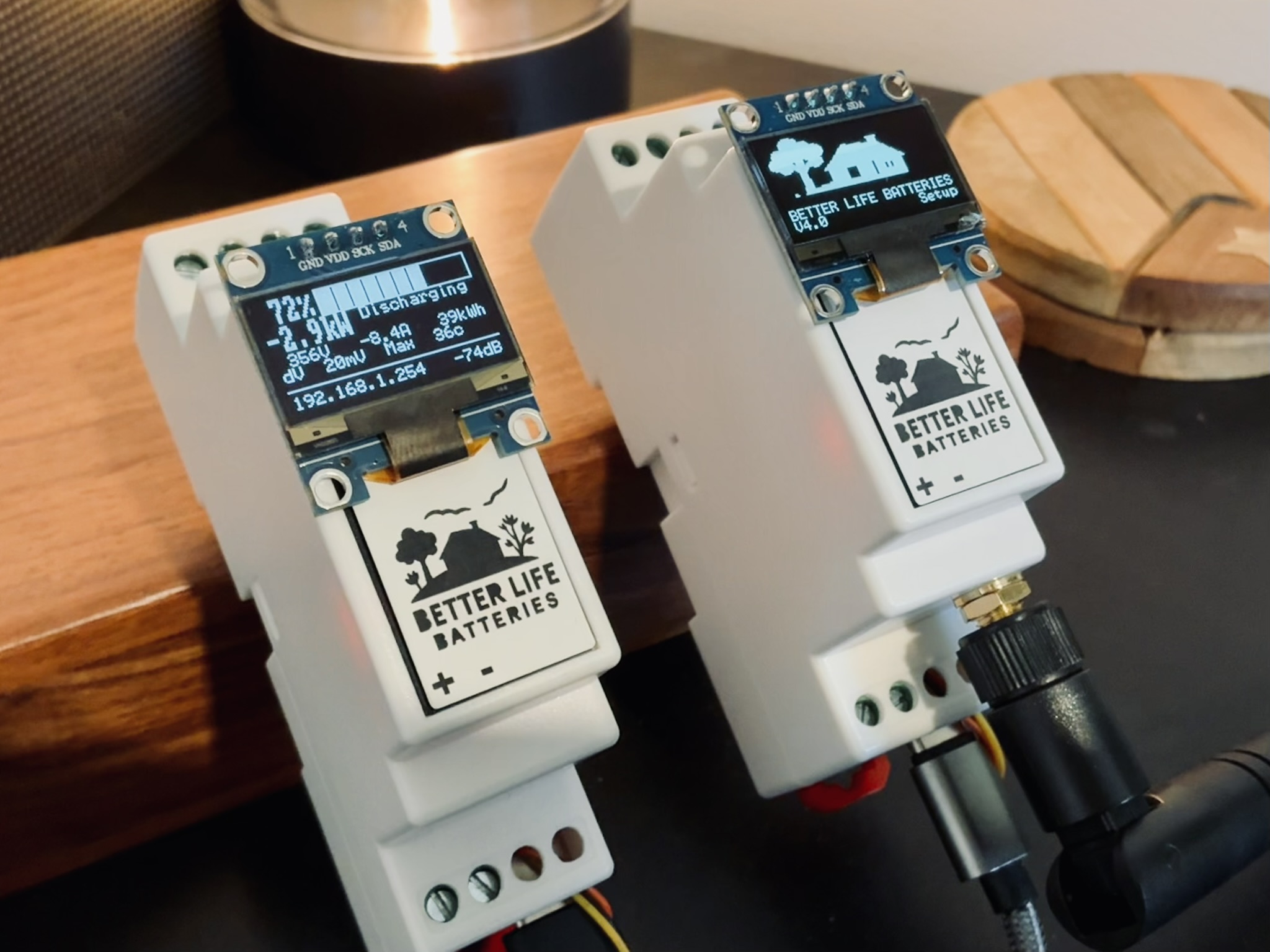 Two Better Life Batteries communication bridge processors — DIN-rail modules with OLED displays showing live battery status